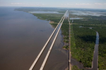 Located four feet above sea level, Interstate 10 runs southeast through Lake Ponchartrain’s wetlands to New Orleans, Louisiana.