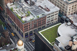 Different uses and aesthetics of green roofs in the Flatiron District of Manhattan. The roof of Staples, Inc., is covered in a thin layer of soil low-maintenance plants, in contrast to the decorative social spaces across Avenue of the Americas, and of the adjacent O'Neill Building.