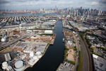 Newtown Creek, an industrial canal, extends New York’s tidal line into Greenpoint, Brooklyn. The Newtown Creek wastewater treatment plant lies on the left bank.
