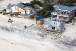 A house on Ocean Beach, Fire Island, New York, situated in front of the dunes, was pushed off of its stilt foundation by Hurricane Sandy in 2012.