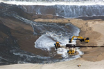 Bulldozers redistribute sand that has been pumped from offshore to widen beaches in Deal, New Jersey following Hurricane Sandy.