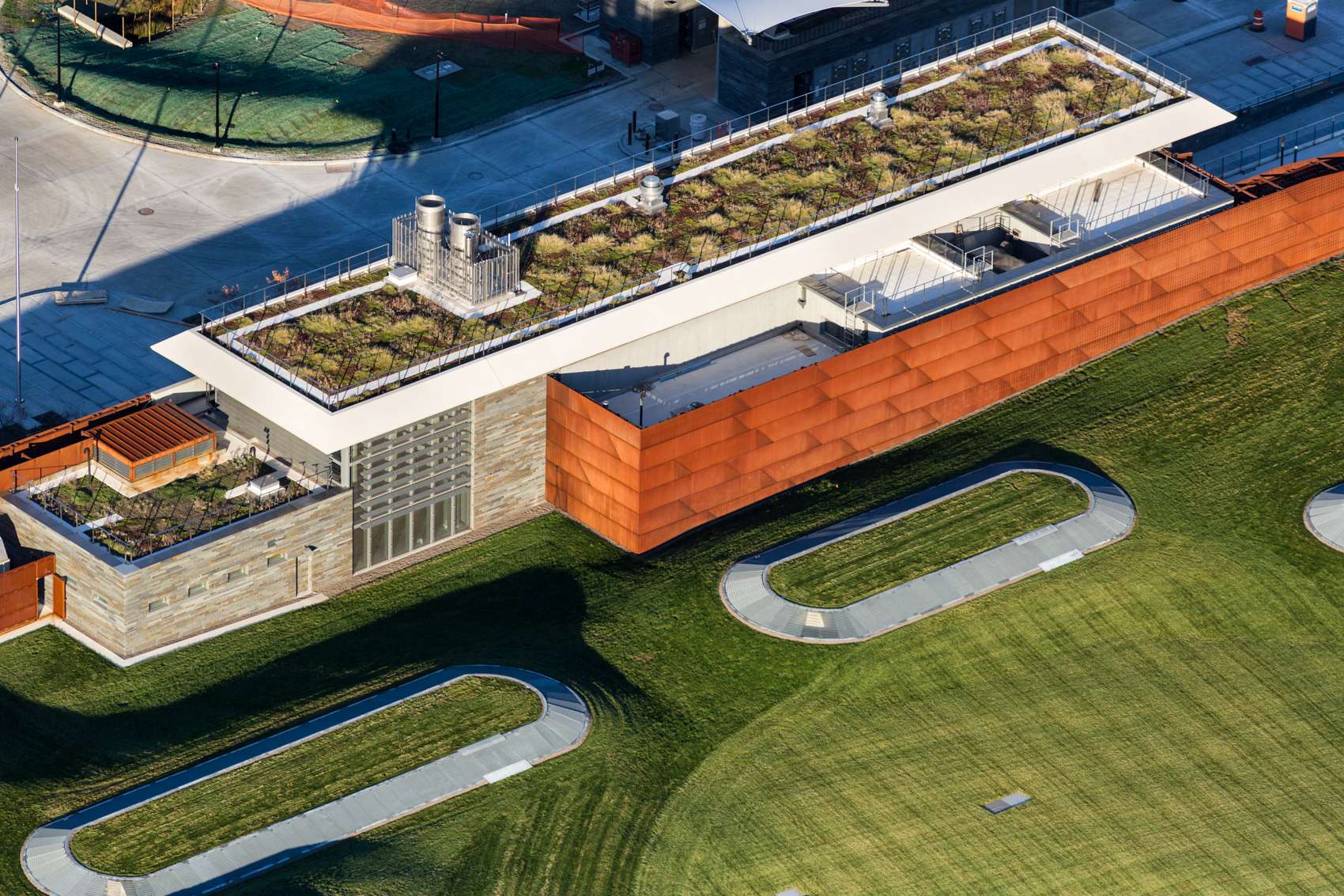 The Mosholu Golf Course, designed by Grimshaw Architects and Ken Smith Landscape Architects, is situated atop the Croton Water Treatment Plant in the Bronx, NY. Croton  is the largest infrastructure project for the City of New York, processing a third of NYC's drinking water. The building is nine acres wide, and sinks 12 stories into the earth. The golf course, which is the largest continuous living roof in North America, is the only visible part of the plant. Croton is surrounded by a wetland stormwater and groundwater management system designed by Great Ecology as part of the Grimshaw Architects team.