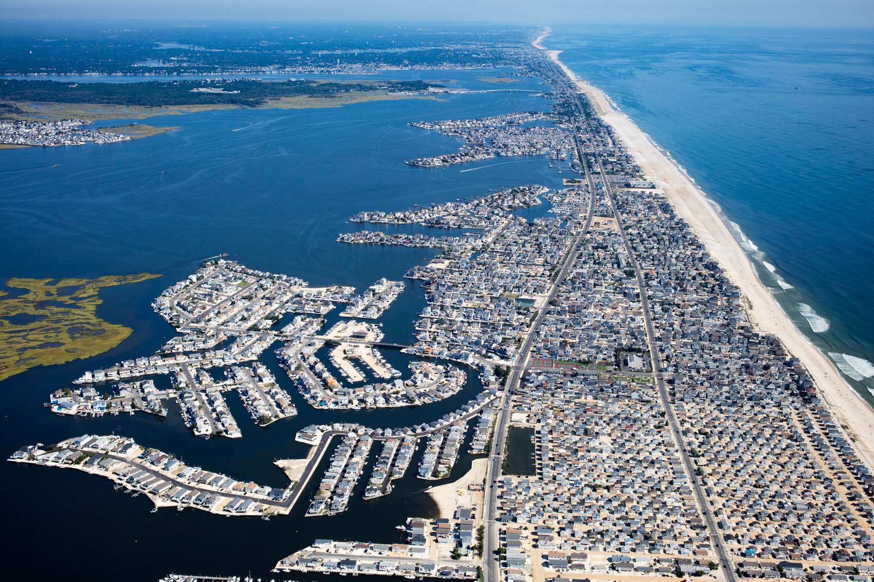 Cut and filled lagoon keys are built behind a barrier island in Lavallette, New Jersey, demonstrating the demand for waterfront real estate.