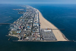 The southern tip of Ocean City, Maryland is the stabilized end of a barrier island that stretches for miles, as far north as Delaware. Though it only has around seven thousand residents, the population swells with tourists to over three hundred thousand on summer weekends, hosting eight million per year.