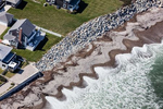 Beach cusps push up against rip rap intended to protect houses from shoreline erosion in Scituate, Massachusetts.
