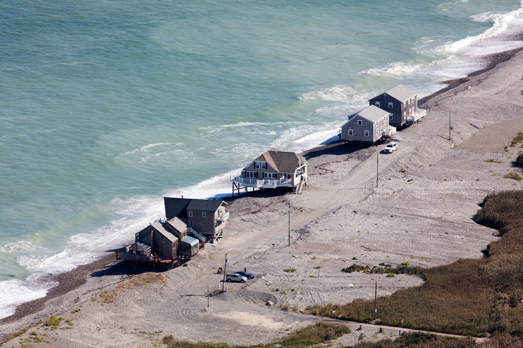 Houses built onto the edge of the beach in Scituate, Massachusetts are at the mercy of storm surge and waves.