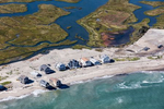 More than a dozen homes on Peggotty Beach in Scituate, Massachusetts were demolished in the 1990’s as part of a federal buyout program following major storms. Current residents struggle to maintain sand in front of their homes and the road that provides access to town.