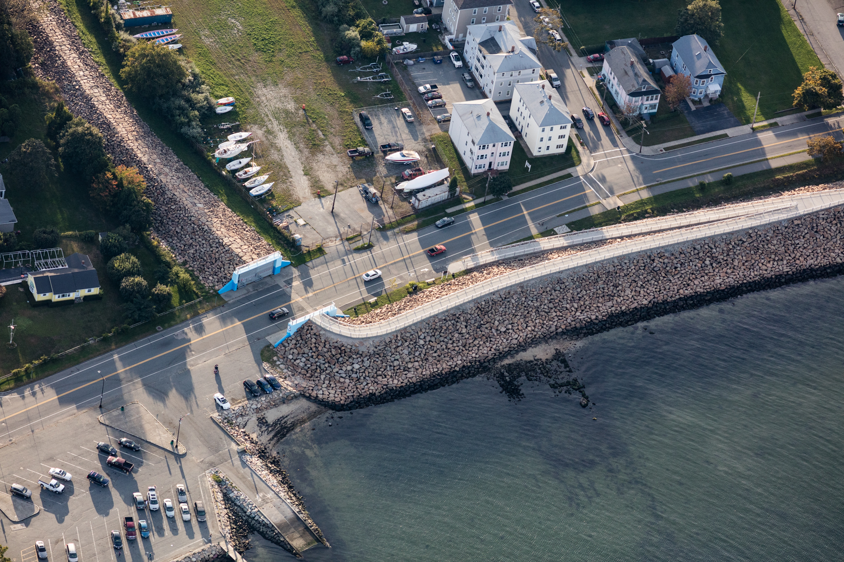 Following storms in the first half of the 20th Century, New Bedford, Massachusetts began construction a 3.5 mile dike in the form of a 20 foot high rock wall in 1962. The wall is designed to protect against a 16 foot storm surge, equivalent to a category 3 storm, however if sea level rises 1-2 feet, the wall would be overwhelmed by category 3+ storms.