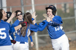 Yeshiva University's softball team celebrates as runner scores