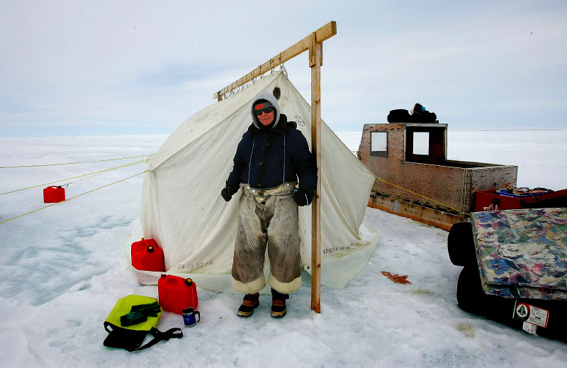 the tent I stayed in with the reporter and a guide while working in the high arctic circle and the clothing they made me wear to stay alive.