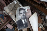 Old photos were scattered on the ground where the auto dealer ship used to be. The stamp on the back of the photos credited Murwin Mosler, (who graduated from Joplin high school in 1935) a photographer who documented Joplin. This photo was blown from his archive storage from across the street.