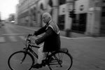 Scartoni cycles through Arezzo on his way to the newsstand in the early morning hours of May 26, 2023.   This has been his routine since 1953.   