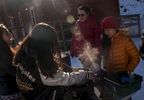 Nirshika Neopany, 14, left, Sapana Rai, 14, middle, Jamie Stanley, 33, and Susmita Limbu, 14, right, prepare breakfast at Camp Alexander at Lake George, Colo. on Feb. 17, 2017. The camp is run by the Boy Scouts of America.