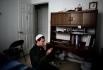 Sulaiman Banwal, 24,  opens the door to his bedroom and slips on his white prayer cap. He unfurls a prayer rug and bends bedside to the floor. He's wearing in a black perahan tunban, the traditional garb of Afghan men. He faces a wall draped with inspirational Islamic sayings.The silence is broken by the rustle of his clothing as he bows prostrate. Somewhere in the distance is Mecca.“Praying is a responsibility for every Muslim,” said Banwal, who, despite living 7,000 miles from home, still prays five times a day. He is a Fulbright Scholar from Kabul, Afghanistan. He attends Old Dominion University and is earning a master's degree in civil engineering.He believes that praying to Allah helps him with his daily life. “In our religion you never lose hope, because losing hope means you're not believing in God anymore.{quote}{quote}You feel like home, you don't feel alone,” he said of the call to prayer. “You're never alone, because God is with you.”