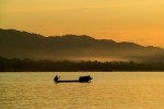 fisherman out at duskMekong River - Laos