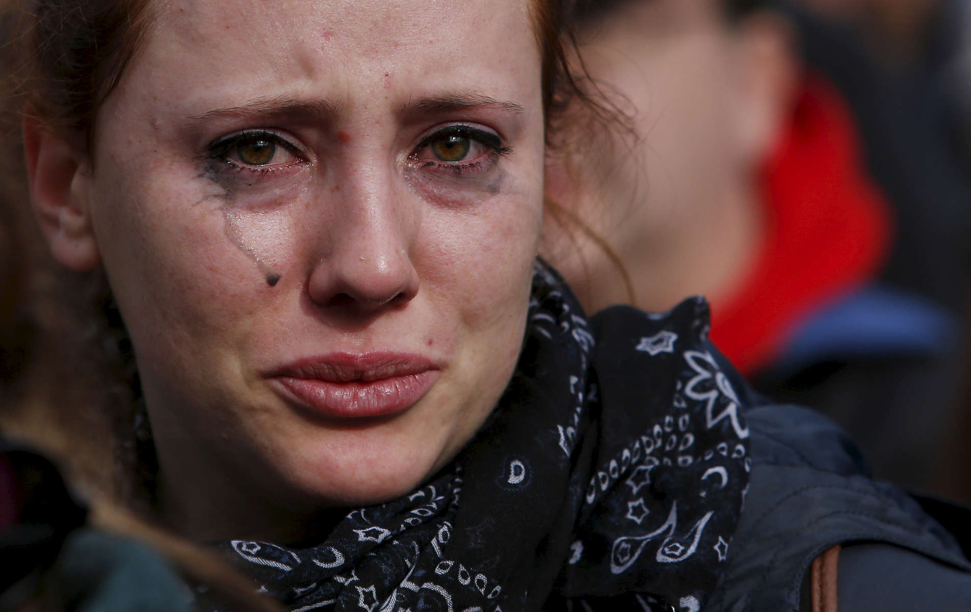 Boston, Massachusetts -- 11/15/2015- Marine Gazan, an au pair from France cries during a rally held on the Boston Common in response to the Paris attacks in Boston, Massachusetts November 15, 2015. 