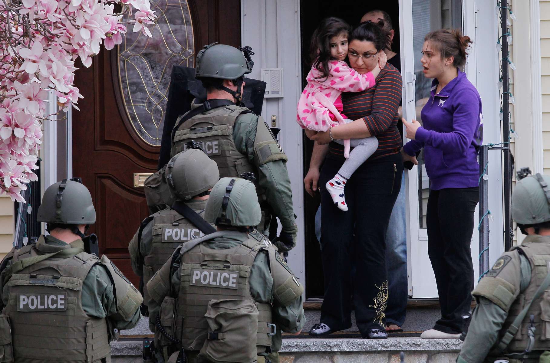 SWAT teams conduct a house to house search as they look for the remaining suspect in the Boston Marathon bombings in Watertown, Massachusetts April 19, 2013. 
