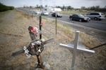 Crosses honoring people who have been killed at the intersection of two major roads are seen in Mattawa, Washington August 23, 2013. Traffic violations run rampant in the town where a large percentage of the residents are not US citizens and many do not have drivers licenses or insurance.