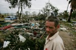 Christopher Cox stands amid debris caused by Hurricane Ike in the trailer park where he lived before his home was destroyed in Galveston, Texas September 14, 2008.