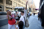 New York, NY--7/20/2018--  Tete started singing Frank Sinatra's 'New York, New York' and she and Patricia threw their arms in the air for Camila as they got to the finale. They had come to New York to renew Patricia's passport at the Honduran Consulate, which took hours but Patricia was determined to show Camila Times Square and give her a taste of the Big Apple before they left.
