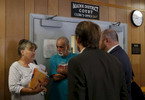 South Paris, Maine -- 7/21/2015-- Without a lawyer they were left without much hope of winning against their old landlord (2nd from L). Lanette and Larry went into the hallway after the judge asked if they might be able to come to an agreement. Things were complicated, the landlord had already sold the land to someone else and the new owner eventually agreed to box up some of the family photos left behind and leave them at the police station for the Grants to retrieve. Jessica Rinaldi/Globe Staff