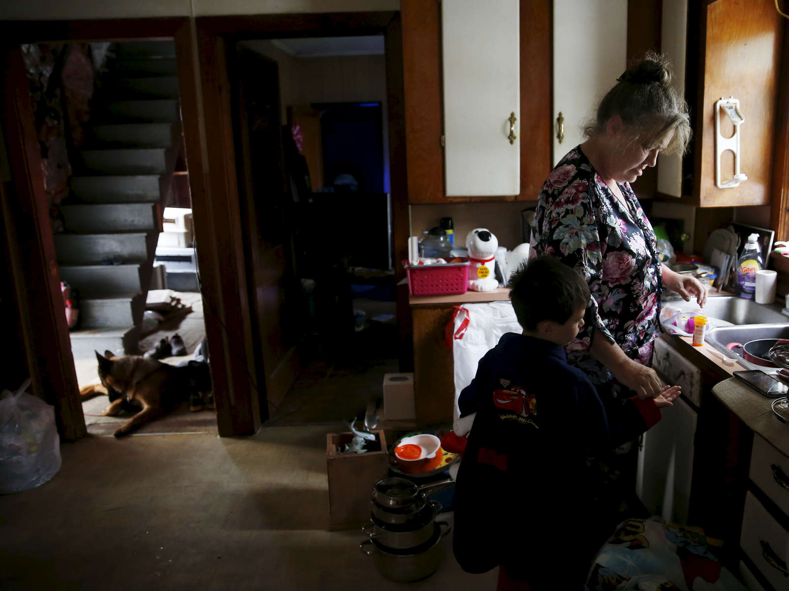 Lisbon, Maine -- 8/11/2015-- “Medicine!” Lanette called as she pulled out the plastic bin of the boys’ medicines. Strider extended his hand for his morning meds. “We haven’t been here 24 hours, and I’m tired already,” Lanette said. Jessica Rinaldi/Globe Staff