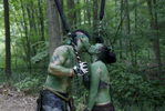 Slippery Rock, PA -- 6/22/2017 -  A couple paused for a kiss as they passed each other during a battle in the woods.