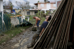 Toa Baja, Puerto Rico -- 9/30/2017 - Ten days after Hurricane Maria hit Puerto Rico, Eric La Luz, 15, and his family were still doing the mentally and physically exhausting work of cleaning out their home. Almost everything in the home was a total loss, but they were eager to move out of the shelter they were living in and get back home. Using a rectangular plastic tub they dragged bin after bin of mud and debris out of their home in Toa Baja. 