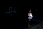 San Juan, Puerto Rico -- 10/01/2017 -   A child, forced into the street with her family to escape the heat inside their public housing apartment, held onto one of the few sources of light in a blacked out San Juan. Nearly four months after Hurricane Maria first made landfall an estimated 40 percent of Puerto Rico is still in the dark. 