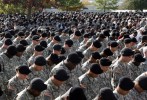 U.S. Army soldiers bow their heads in prayer for their fallen comrades during the III Corps and Fort Hood Memorial Ceremony at Fort Hood, Texas November 10, 2009. The memorial was held to honor the 13 victims of the shootings which took place on the Fort Hood Army post on November 5.