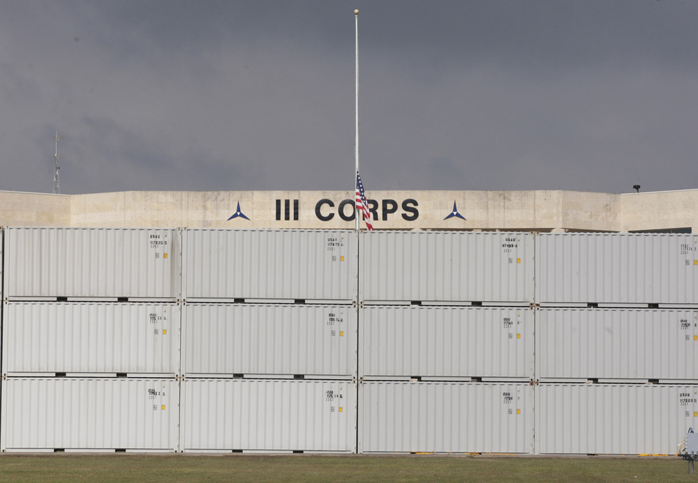 A barrier constructed of shipping containers for a memorial service is seen in front of the III Corps building in Fort Hood, Texas November 9, 2009. President Barack Obama and his wife, Michelle, will attend a memorial service in Fort Hood, Texas, on Tuesday for victims of a mass shooting.
