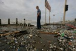 A man looks over the edge of the sea wall as Hurricane Ike approaches in Galveston, Texas September 12, 2008. 