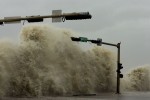 A wave breaks over a street sign as Hurricane Ike approaches Galveston, Texas September 12, 2008. Massive Hurricane Ike bore down on the Texas coast on Friday with a wall of water that threatened a potential catastrophe for the United States.