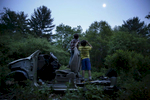 Oxford, Maine -- 5/29/2015--  On the night of the eviction the boys climbed into a rusted Ford sunk behind the horse field. Strider held a broken automotive hose to his eyes like a pair of binoculars. He tipped his head upward. “What’s on the moon?” Strider asked.Jessica Rinaldi/Globe Staff