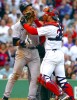 Boston Red Sox catcher Jason Varitek (R) pushes his glove into New York Yankees player Alex Rodriguez's face at Fenway Park in Boston, Massachusetts July 24, 2004.