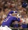 Texas Rangers Sammy Sosa's helmet flys off after he was hit in the head by a pitch from New York Yankees' pitcher Brian Bruney during the sixth inning of their MLB American League game in Arlington, Texas, May 3, 2007.