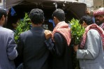 Men buying qatSana'a, Yemen