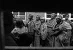 The families of Rwandan Hutu rebels stand in line for food at a transition camp of the UNHCR in Goma, Demcratic Republic of Congo.  Nervous about their transition from Congo back to Rwanda, many of these familes have not seen their home country in 15 years.