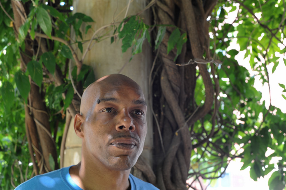 Mark Clements, a victim of Chicago police torture that occurred while Jon Burge was Commander, sits in a park in the South Loop in Chicago, Illinois on August 16, 2015.  Clements was 16 when he was arrested, tortured and accused of arson and involvement in the death of four individuals inside the building where the fire occurred and convicted at 17 before serving 26 years for a crime he did not commit; while in initial detention, police beat a false confession out of him by striking him repeatedly and squeezing his genitals.