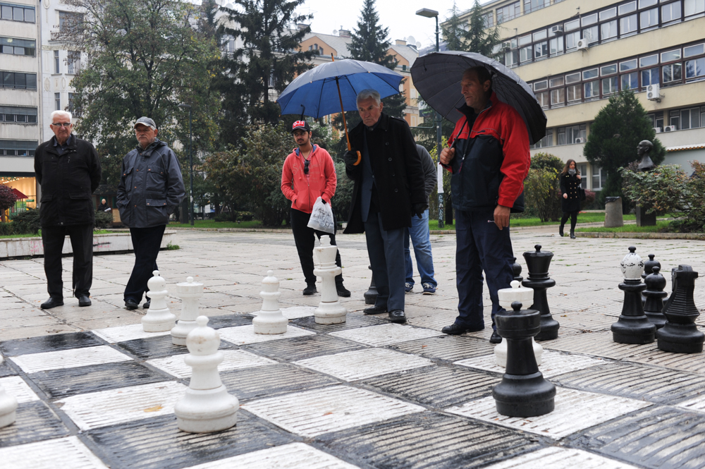 SARAJEVO, BOSNIA AND HERZEGOVINA.  Meho Zekic, 72, and {quote}the butcher{quote} play chess with oversized pieces at a park on October 23, 2014.