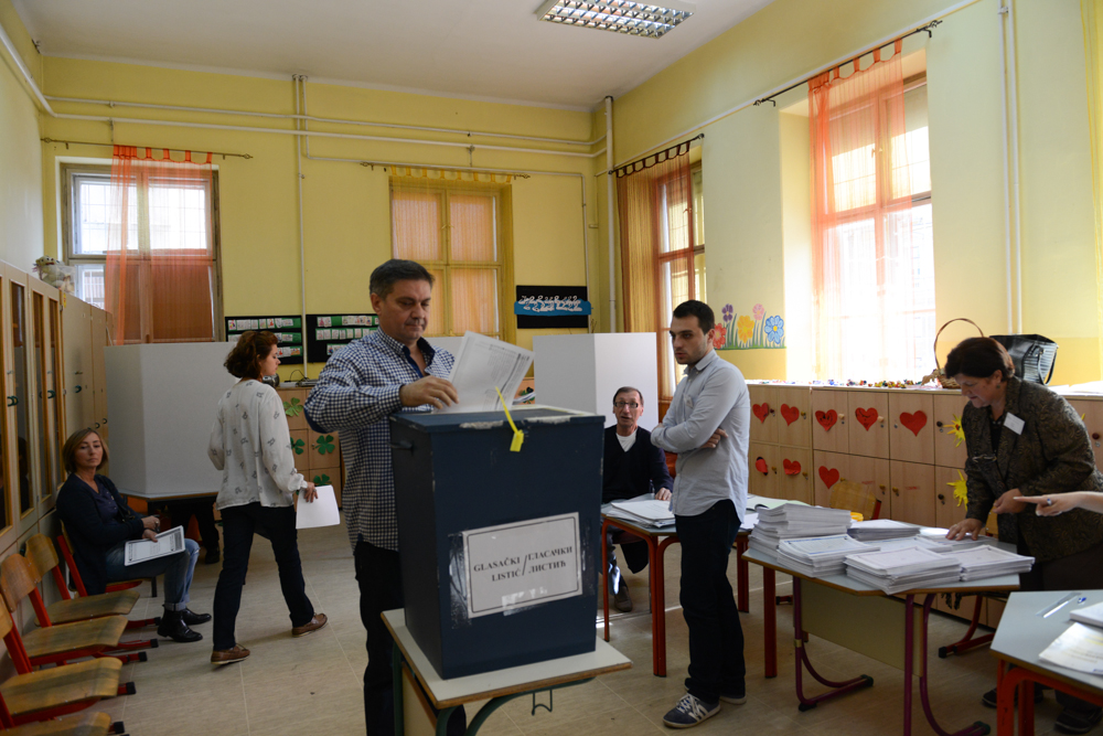 SARAJEVO, BOSNIA AND HERZEGOVINA.  A man casts his ballot in Bosnia's elections in a school classroom on October 12, 2014.  With 92 political parties and a tripartite presidency shared between a Serb, a Croat and a Bosniak, Bosnia's political system has been dubbed one of the most complex on earth.