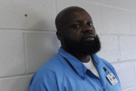 ROBINSON, ILLINOIS. Marcus Wiggins, who was beaten and electrotortured by several Chicago Police detectives working under Commander Jon Burge at Area 3 in September 1991, sits in an administrative office of the Robinson Correctional Center on August 10, 2016.  Wiggins received a $95,000 settlement which did not end his troubles as the same group of officers sought to pin two more murder cases on him, the first having been when he was tortured age 13, the second was thrown out of court by  the judge who called the case flimsy and the third attempt of the same group of officers was successful when the case landed in front of Judge Dennis Dernbach, a former Assistant State's Attorney who worked on Area 2 cases when Burge was Commander there.
