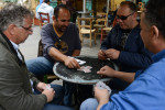 NICOSIA, CYPRUS.  (L-r) Anthoulis Myrianthous, 56, a former banker at the Bank of Cyprus, Doros Limbouris, 35, a civil engineer, Panayiotis Markou, 44, an employee at the Bank of Cyprus and George Tsountas, 44, a civil engineer, sit around and play the card game pilota at the Cafe Kala Kathoumena in the old city since their jobs are on hold until the banks reopen on March 26, 2013.