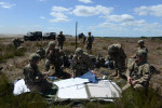 DRAWSKO POMORSKIE TRAINING AREA, POLAND.  American soldiers with the Fourth of the 319th Airborne Field Artillery Regiment of the 173rd Airborne Brigade Combat Team examine their maps and communications following an airdrop from a C-17 aircraft that took off from Nuremberg, Germany and dropped on June 15, 2015.  NATO is engaged in a multilateral training exercise {quote}Saber Strike,{quote} the first time Poland has hosted such war games, involving the militaries of Canada, Denmark, Germany, Poland, and the United States.