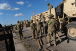 DRAWSKO POMORSKIE TRAINING AREA, POLAND.  American soldiers with the 15th Engineer Battalion help unload $28.5 million of equipment for a two week-long NATO exercise on June 10, 2015.  NATO is engaged in a multilateral training exercise {quote}Saber Strike,{quote} the first time Poland has hosted such war games, involving the militaries of Canada, Denmark, Germany, Poland, and the United States.