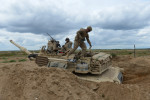 DRAWSKO POMORSKIE TRAINING AREA, POLAND.  American soldiers with the 2nd Battalion, 7th Infantry Regiment, 1st Armored Brigade Combat Team, 3rd Infantry Division based out of Fort Stewart, Georgia in an American Abrams M1A2 tank in position during a live fire exercise on June 16, 2015.  NATO is engaged in a multilateral training exercise {quote}Saber Strike,{quote} the first time Poland has hosted such war games, involving the militaries of Canada, Denmark, Germany, Poland, and the United States.