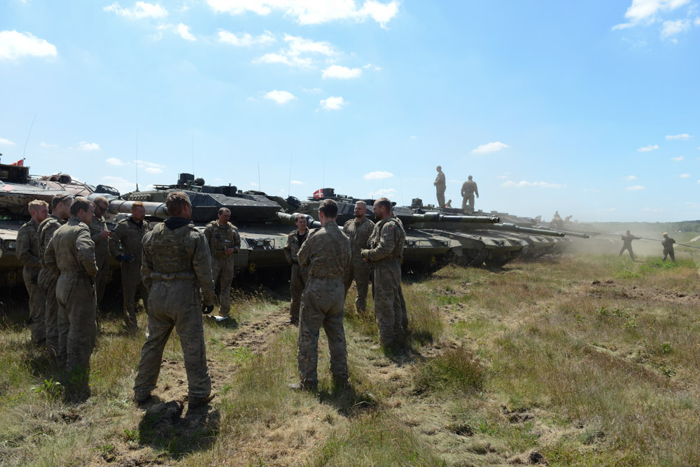 DRAWSKO POMORSKIE TRAINING AREA, POLAND.  Danish soldiers with the First Armored Battalion in German-made Leopard 2A5 tanks following a live fire exercise on June 17, 2015.  NATO is engaged in a multilateral training exercise {quote}Saber Strike,{quote} the first time Poland has hosted such war games, involving the militaries of Canada, Denmark, Germany, Poland, and the United States.