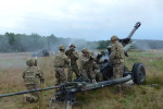 DRAWSKO POMORSKIE TRAINING AREA, POLAND.  American soldiers with the 173rd Airborne load and fire an M119A3 howitzer on June 18, 2015.  NATO is engaged in a multilateral training exercise {quote}Saber Strike,{quote} the first time Poland has hosted such war games, involving the militaries of Canada, Denmark, Germany, Poland, and the United States.