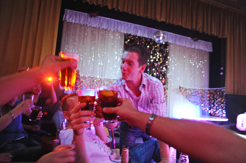 PRAGUE, CZECH REPUBLIC.  Stag night tourist and soon to be married Michael Klos, 23, of Rotterdam, the Netherlands toasts with his friends at the Goldfinger strip club on Weneslaus Square in Prague, Czech Republic on August 12, 2011.