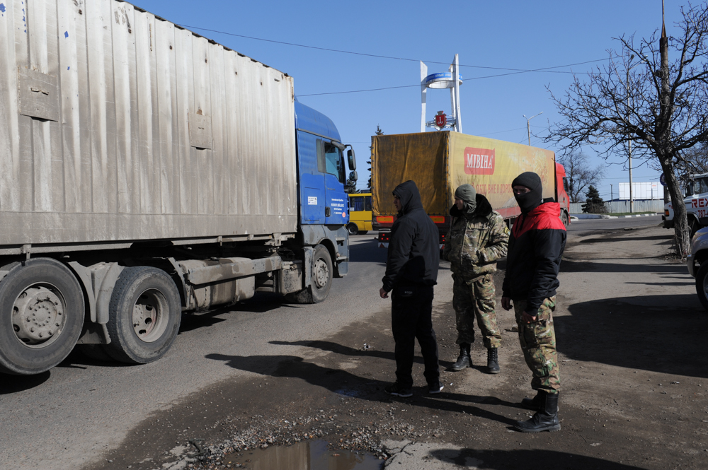 ODESSA, UKRAINE.  A road block set up by Ukrainian pro-Maidan activists and soldiers at the entrance to Odessa from Transdnistria, located 15 kilometers down the road, on February 18, 2016.  Two days prior to this photograph, a truck carrying guns from Russia was stopped from entering Odessa.